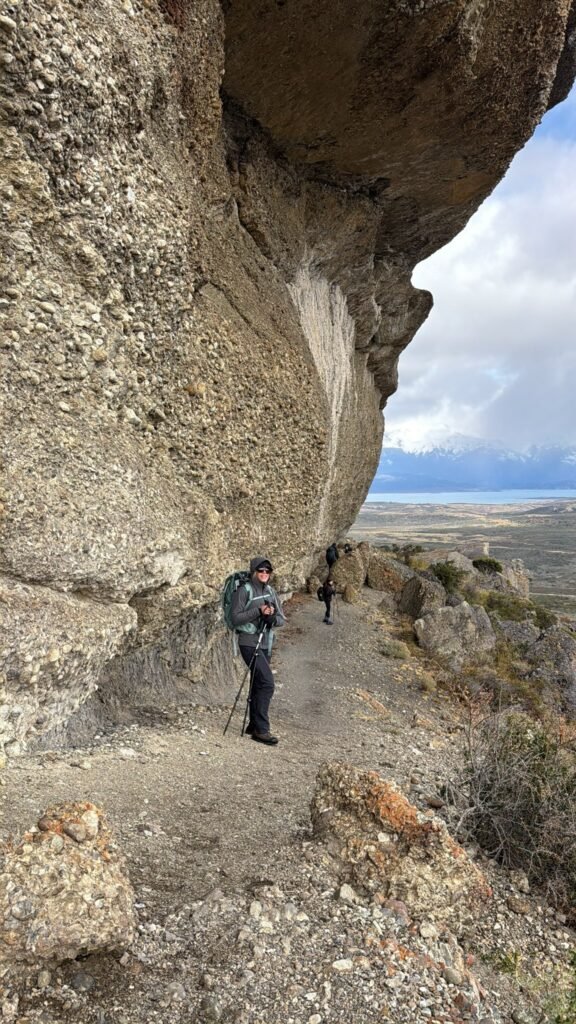 Mr Bader pausing on a trek around a rock face in Patagonia
