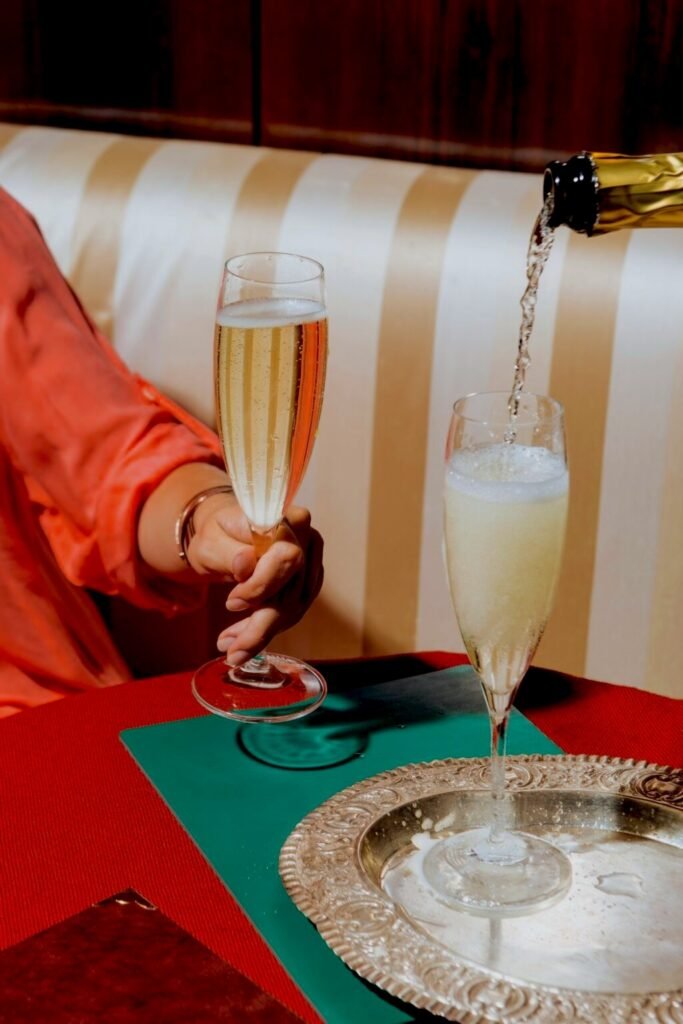 champagne being poured into a flute at christmas